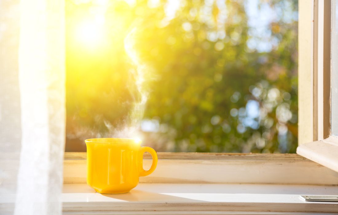 YELLOW MUG OF HOT TEA