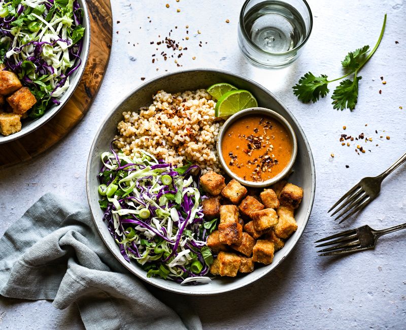 CRISPY TOFU, BROWN RICE, AND CABBAGE BOWLS WITH A PEANUT-CHILI-LIME SAUCE- VEGAN
